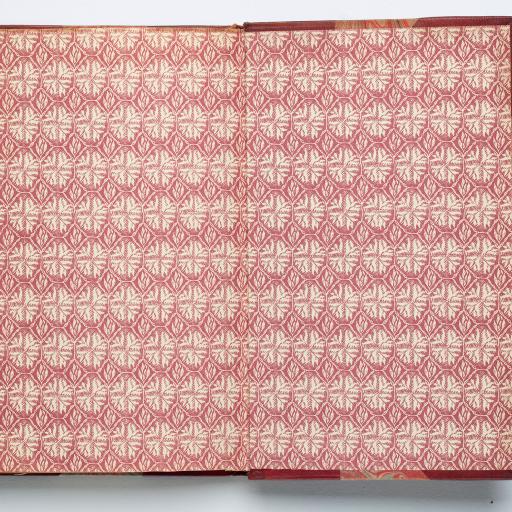 An open book with red and white patterned paper