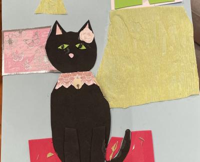 Artwork of a black cat sitting on a red rug