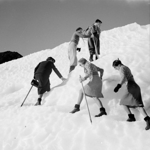 Women climbing snowy mountains