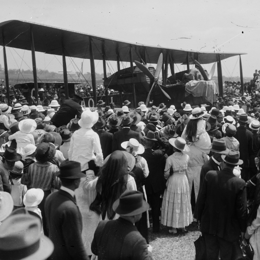 Crowd watching a plane prepare for flight