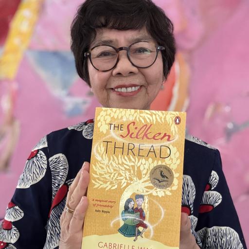 Gabrielle Wang holding book The Silken Thread