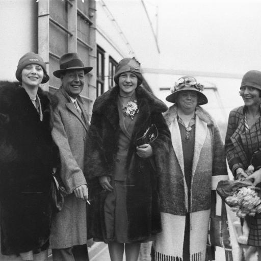 A black and white photograph of a group of 5 people